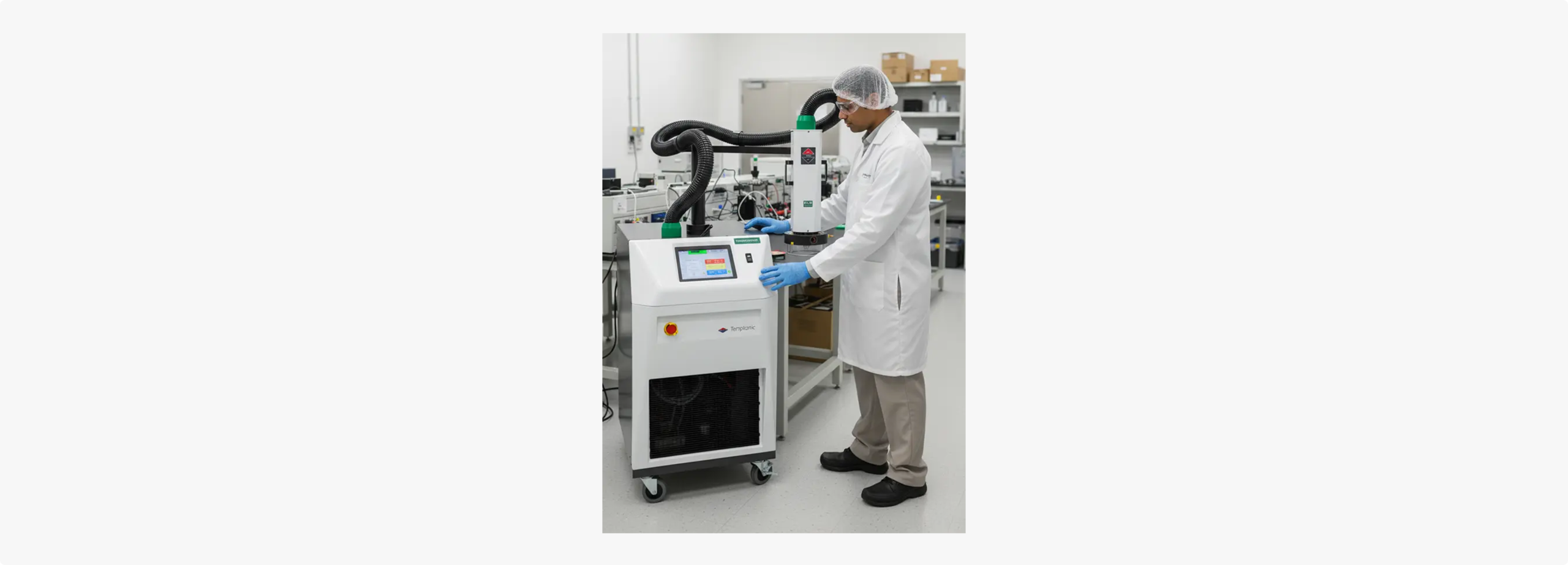 Technician operating a temperature forcing system in a laboratory.